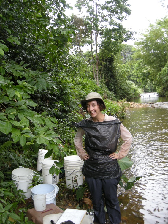 Amy attempts to stay dry during rainy season sampling.