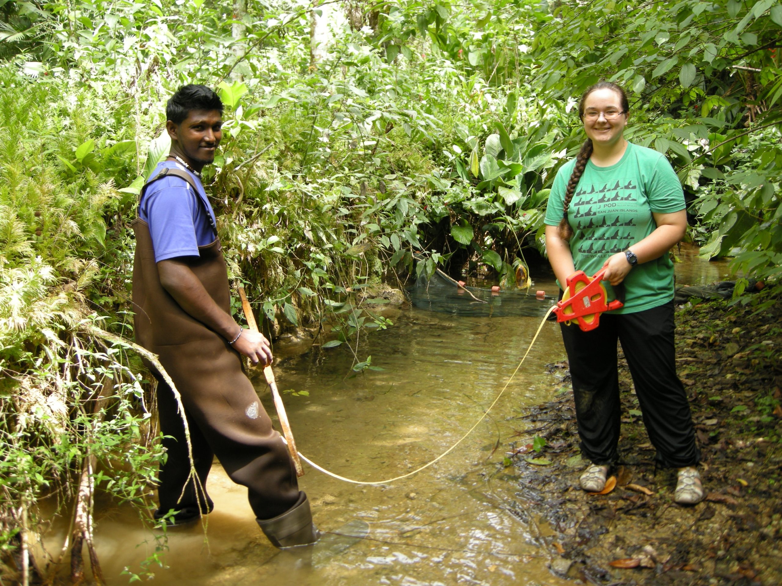 Avinash and Annelise measuring stream width at the Upper Aripo site.